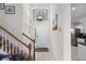 Bright foyer with a staircase, tile flooring, and a decorative chandelier at 909 Troon Cir, Davenport, FL 33897