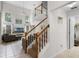 Open living room featuring a staircase, tile floors, and abundant natural light at 909 Troon Cir, Davenport, FL 33897