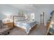 Serene main bedroom featuring a comfortable bed, stylish decor, and ample natural light at 909 Troon Cir, Davenport, FL 33897