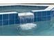 Pool with waterfall detail, an attractive feature of this pool area at 909 Troon Cir, Davenport, FL 33897