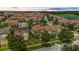 Aerial view of a neighborhood featuring well-maintained homes with tile roofs and mature trees at 10067 Mere Pkwy, Orlando, FL 32832