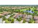 Beautiful aerial view of a community on a golf course and lake at 10067 Mere Pkwy, Orlando, FL 32832