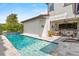 The home's exterior highlights a beautiful pool and covered patio for outdoor entertaining at 10067 Mere Pkwy, Orlando, FL 32832