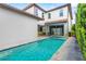Beautiful backyard featuring a private pool, patio, and lush landscaping at 10067 Mere Pkwy, Orlando, FL 32832
