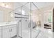 Luxurious bathroom featuring a spacious walk-in glass shower, double vanities, and elegant finishes at 10067 Mere Pkwy, Orlando, FL 32832