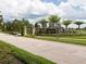 Community entrance sign surrounded by landscaping and a decorative brick pillar at 10067 Mere Pkwy, Orlando, FL 32832