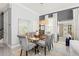 Sophisticated dining room featuring an elegant glass table and decorative lighting at 10067 Mere Pkwy, Orlando, FL 32832