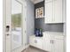 Functional entryway with built-in storage and convenient access to the outdoors at 10067 Mere Pkwy, Orlando, FL 32832
