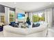 Cozy living room with decorative fireplace, comfortable seating, and seamless access to pool at 10067 Mere Pkwy, Orlando, FL 32832