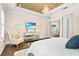 Chic main bedroom showcases mirrored furniture, hardwood flooring, and decorative artwork at 10067 Mere Pkwy, Orlando, FL 32832