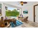 Well-designed patio area offers a relaxing outdoor space, TV, and backyard access at 10067 Mere Pkwy, Orlando, FL 32832