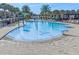 Community pool featuring a splash pad with colorful fountains and lounge chairs for parents and children at 10067 Mere Pkwy, Orlando, FL 32832