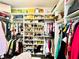 Large walk-in closet with organized shelves for clothes, shoes, and accessories at 10067 Mere Pkwy, Orlando, FL 32832