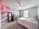 Bright bedroom features chevron accent wall, gray carpet and a large mirror at 12606 Old Plantation Ln, Orlando, FL 32824