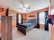 Bright bedroom with blue accents, soft carpet, and natural light at 12606 Old Plantation Ln, Orlando, FL 32824