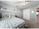Cozy bedroom featuring a comfortable bed, soft carpet, and natural light at 12606 Old Plantation Ln, Orlando, FL 32824