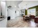Open floor plan featuring hardwood floors, a large dining table, and neutral color palette at 12606 Old Plantation Ln, Orlando, FL 32824