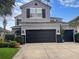 Charming two-story home with well-maintained landscaping and a spacious two-car garage at 12606 Old Plantation Ln, Orlando, FL 32824