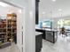 Well-stocked walk-in pantry and spacious kitchen island with stainless steel appliances in this open floor plan at 12606 Old Plantation Ln, Orlando, FL 32824
