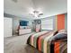 Spacious primary bedroom featuring soft carpet, ceiling fan, and a neutral color palette at 12606 Old Plantation Ln, Orlando, FL 32824