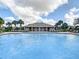 Resort-style pool with poolside furniture for relaxing in a tropical setting at 12606 Old Plantation Ln, Orlando, FL 32824