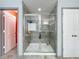 Modern shower with sleek glass doors and tiled walls at 12606 Old Plantation Ln, Orlando, FL 32824