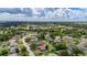 Aerial view of the property within a residential area, showing proximity to local amenities and neighborhood features at 138 Hidden Pointe Ln, Groveland, FL 34736