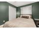 Comfortable bedroom with plush bedding, natural light, closet and ceiling fan at 138 Hidden Pointe Ln, Groveland, FL 34736