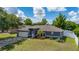 Landscaped front yard and inviting exterior showcasing the property's appeal at 138 Hidden Pointe Ln, Groveland, FL 34736