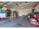 Spacious two-car garage with ample storage and a car at 138 Hidden Pointe Ln, Groveland, FL 34736