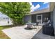 Backyard patio with patio set and a grill at 138 Hidden Pointe Ln, Groveland, FL 34736