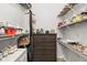 Walk-in closet with custom shelving, providing ample storage for shoes and accessories at 138 Hidden Pointe Ln, Groveland, FL 34736