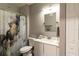 Bathroom featuring vanity, toilet, tub, and shower with marble curtain at 14205 Falls Church Dr # 2012, Orlando, FL 32837