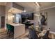 Chic kitchen with stainless steel appliances, modern lighting, and a stylish island, offering a contemporary cooking space at 14205 Falls Church Dr # 2012, Orlando, FL 32837