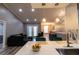 Open-concept living space with a modern kitchen, a cozy living area, and stylish decor, perfect for Gathering living at 14205 Falls Church Dr # 2012, Orlando, FL 32837