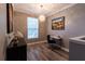 Cozy home office with a bright window, a modern desk, and elegant decor, creating a productive workspace at 14205 Falls Church Dr # 2012, Orlando, FL 32837