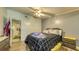Bedroom featuring a ceiling fan, providing a calming space for relaxation, complemented by neutral tones and natural light at 1431 Jack Calhoun Dr, Kissimmee, FL 34741