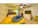 Bedroom featuring a ceiling fan and a view of the exterior, providing a calming space for relaxation at 1431 Jack Calhoun Dr, Kissimmee, FL 34741