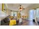 Comfortable living room with laminate flooring, a ceiling fan, and stylish furnishings at 1431 Jack Calhoun Dr, Kissimmee, FL 34741