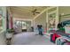 Enclosed patio offering a ceiling fan, and access to the outdoors, with ample space for storage and exercise equipment at 1431 Jack Calhoun Dr, Kissimmee, FL 34741