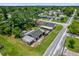 Aerial view of a residential area with homes, tree coverage, and roadways at 1501 Missouri Ave, St Cloud, FL 34769