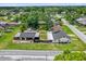 This aerial view highlights a home, detached garage, and spacious backyard at 1501 Missouri Ave, St Cloud, FL 34769