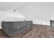 Attic space with hardwood floors and an Intex air mattress at 1501 Missouri Ave, St Cloud, FL 34769