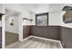 Basement room with vinyl flooring, brick accent wall, and small window at 1501 Missouri Ave, St Cloud, FL 34769