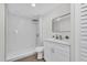 Modern bathroom featuring a walk-in shower with a marble tile surround and floating vanity at 1501 Missouri Ave, St Cloud, FL 34769