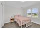 Serene bedroom with a comfortable bed, fresh decor, and soft natural lighting at 1501 Missouri Ave, St Cloud, FL 34769