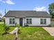Charming single-story home featuring a fresh white exterior, well-maintained lawn, and a classic mailbox at 1501 Missouri Ave, St Cloud, FL 34769