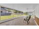 Sunroom with screened windows, tiled floor, and views of the backyard at 1501 Missouri Ave, St Cloud, FL 34769