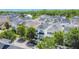 Aerial view of a residential neighborhood with colorful houses and tree-lined streets at 1513 Resolute St, Celebration, FL 34747