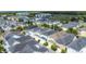High angle aerial view showcases neighborhood houses with gray roofs and green trees at 1513 Resolute St, Celebration, FL 34747